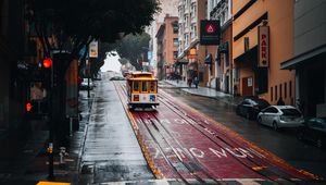 Preview wallpaper tram, rails, street, rain, buildings