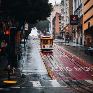 Preview wallpaper tram, rails, street, rain, buildings