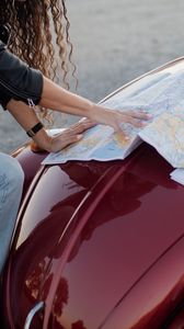 Preview wallpaper travel, map, guidebook, hood, car, hands