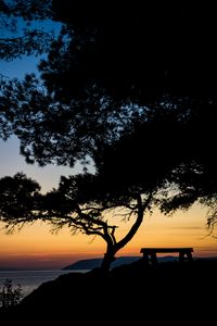 Preview wallpaper tree, bench, silhouettes, sea, twilight