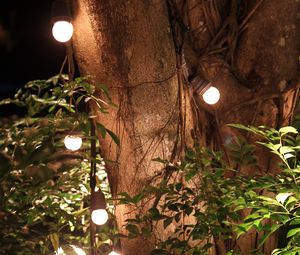 Preview wallpaper tree, leaves, garland, glow