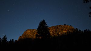 Preview wallpaper tree, rock, mountain, night