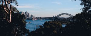 Preview wallpaper trees, buildings, city, river, boats, sky