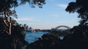 Preview wallpaper trees, buildings, city, river, boats, sky