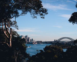 Preview wallpaper trees, buildings, city, river, boats, sky