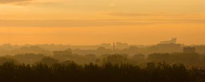 Preview wallpaper trees, buildings, tower, silhouettes, fog, sunrise