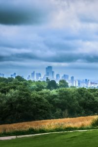 Preview wallpaper trees, city, buildings, meadow