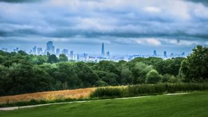 Preview wallpaper trees, city, buildings, meadow