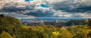 Preview wallpaper trees, clouds, sky, city, tower