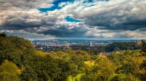 Preview wallpaper trees, clouds, sky, city, tower