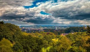 Preview wallpaper trees, clouds, sky, city, tower