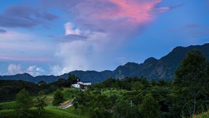 Preview wallpaper trees, hills, grass, mountains, sky, clouds, landscape