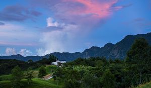 Preview wallpaper trees, hills, grass, mountains, sky, clouds, landscape