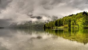 Preview wallpaper trees, lake, coast, clouds, haze, cloudy