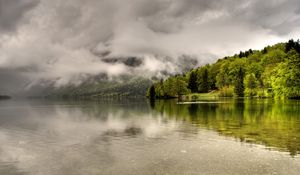 Preview wallpaper trees, lake, coast, clouds, haze, cloudy