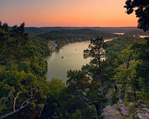 Preview wallpaper trees, lake, mountains, height, from above, look, decline, evening, orange, stony, snags