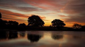 Preview wallpaper trees, lake, reflection, evening, sunset