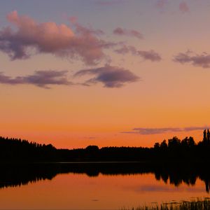 Preview wallpaper trees, silhouettes, forest, lake, clouds, sky, sunset, landscape