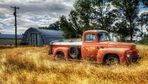 Preview wallpaper truck, garage, field, farming, column, wires, clearly