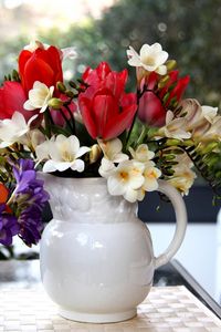 Preview wallpaper tulips, freesia, flowers, glass, jar, beauty