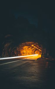 Preview wallpaper tunnel, backlight, movement, dark, rock, long exposure, road, night