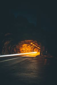 Preview wallpaper tunnel, backlight, movement, dark, rock, long exposure, road, night