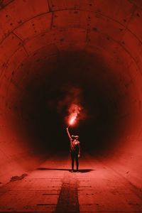 Preview wallpaper tunnel, man, gas mask, light, fire, red