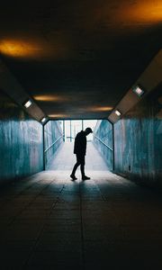 Preview wallpaper tunnel, silhouette, underground, dark, loneliness