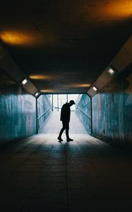 Preview wallpaper tunnel, silhouette, underground, dark, loneliness