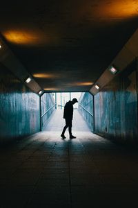 Preview wallpaper tunnel, silhouette, underground, dark, loneliness