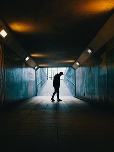 Preview wallpaper tunnel, silhouette, underground, dark, loneliness