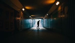 Preview wallpaper tunnel, silhouette, underground, dark, loneliness