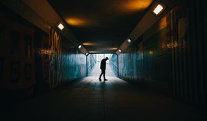 Preview wallpaper tunnel, silhouette, underground, dark, loneliness