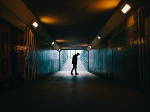 Preview wallpaper tunnel, silhouette, underground, dark, loneliness