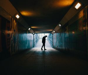 Preview wallpaper tunnel, silhouette, underground, dark, loneliness