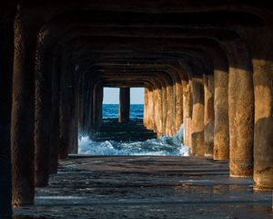 Preview wallpaper tunnel, water, waves, sand, pier