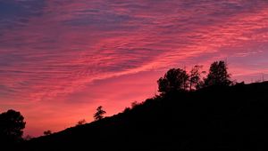 Preview wallpaper twilight, trees, outlines, hill, sky, clouds