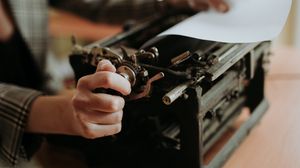 Preview wallpaper typewriter, paper, hands, retro