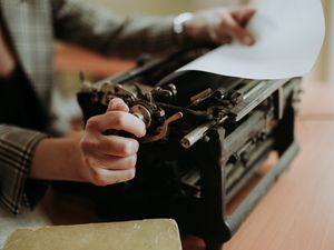 Preview wallpaper typewriter, paper, hands, retro
