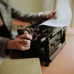 Preview wallpaper typewriter, paper, hands, retro