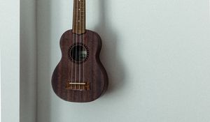 Preview wallpaper ukulele, musical instrument, strings, wall