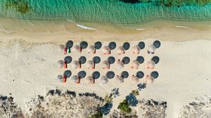 Preview wallpaper umbrellas, beach, aerial view, sea