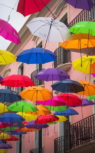 Preview wallpaper umbrellas, building, colorful, balcony