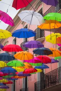 Preview wallpaper umbrellas, building, colorful, balcony