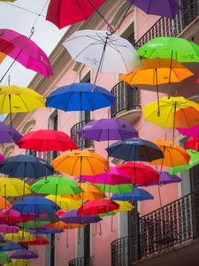 Preview wallpaper umbrellas, building, colorful, balcony