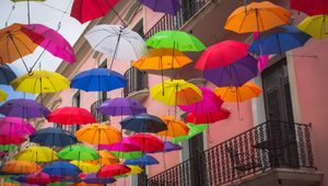 Preview wallpaper umbrellas, building, colorful, balcony