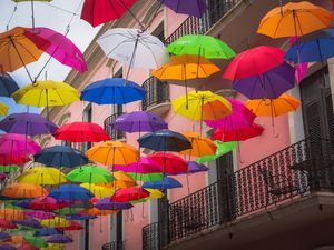 Preview wallpaper umbrellas, building, colorful, balcony