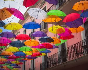 Preview wallpaper umbrellas, building, colorful, balcony