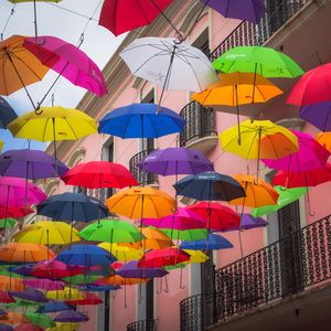 Preview wallpaper umbrellas, building, colorful, balcony