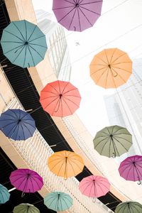 Preview wallpaper umbrellas, colorful, plane, buildings